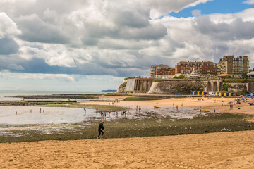 Golden sand of Viking Bay Broadstairs, Thanet, Kent, UK and the historic Bleak House on a sunny...