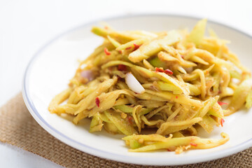 Thai food, spicy green mango salad (Tum Ma Muang)