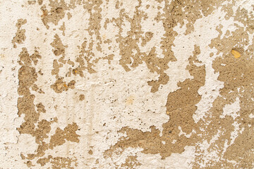 Rough concrete wall texture background. Old cracked plaster crumbles.
