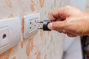 hand unplug electricity to save energy when not use