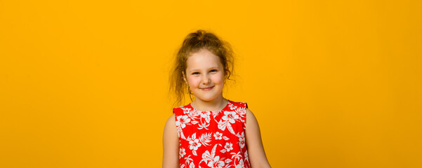 Happy carefree child emotions. Energetic joyful adorable little girl laughing at joke on yellow background.