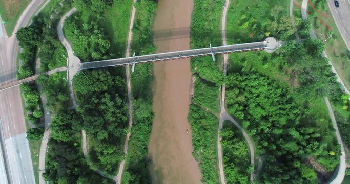 Aerial view of the Buffalo Bayou in Houston, Texas on a sunny day. This video was filmed in 4k for best image quality.