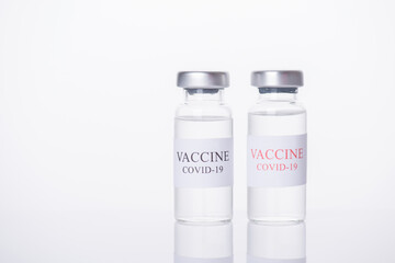 Immunization and COVID-19 treatment concept. Close-up photo of two COVID-19 vaccine vials isolated on white background