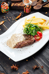 Beef steak under the mushroom cream sauce