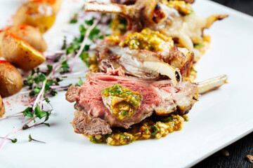 Closeup on gourmet fried lamb chops with sauce 