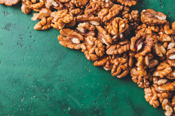 Many tasty walnuts on table