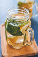 Mason jar of fresh lemonade on table