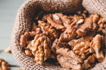 Bag with tasty walnuts, closeup