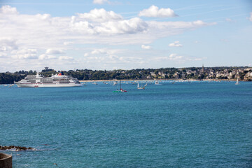Fototapeta premium View from the ramparts at ferry and the town of Dinard. Saint Malo, Brittany, France