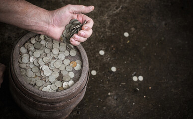Concept of poverty, and destitution, money and  coins. Poor people