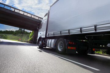 Obraz na płótnie Canvas Truck transport on the road and cargo