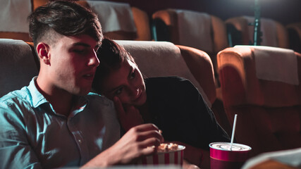 People audience watching movie in the movie theater cinema. Group recreation activity and...