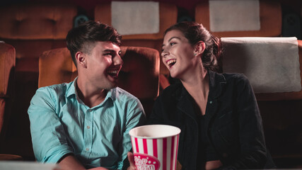 People audience watching movie in the movie theater cinema. Group recreation activity and...