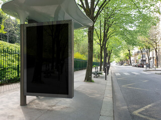 Bus stop billboard Mockup in empty street in Paris. Parisian style hoarding advertisement close to a park in beautiful city © sdecoret