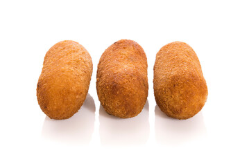 Three Spanish croquettes with reflection isolated on white.