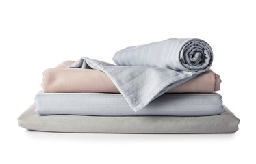 Stack of clean bed sheets on white background