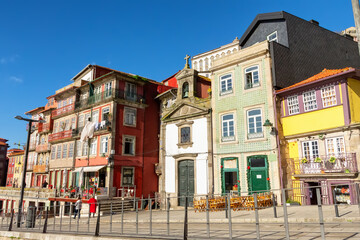 View of the city of Porto from the Eiffel Bridge early in the morning at dawn, small multicolored houses of the Ribeira Quarter