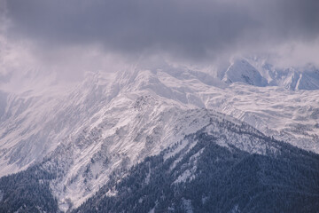 Fototapeta na wymiar Snowy And Frozen Mountains In The Winter