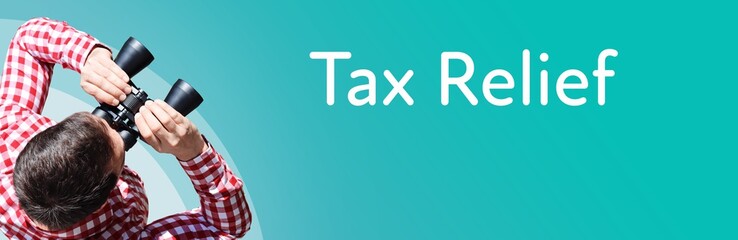 Fototapeta premium Tax Relief. Businessman (man) looks through binoculars. Birds eye view. Focus on text. Blue Background. Business, Finance, Statistics, Analysis, Economy