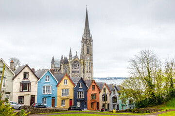 Fototapeta na wymiar Cathedral and colored houses in Cobh, Ireland