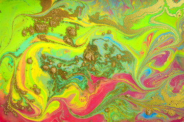 Fluorescent abstract pattern with golden powder scattering.