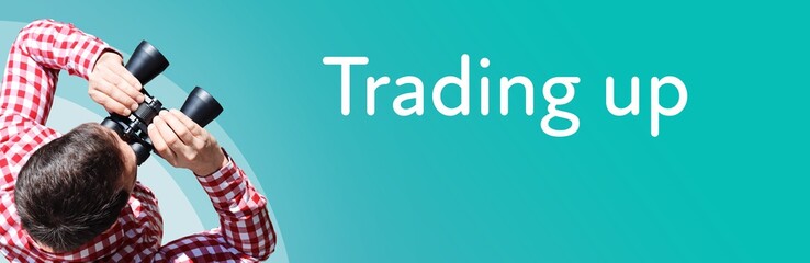 Fototapeta premium Trading up. Businessman (man) looks through binoculars. Birds eye view. Focus on text. Blue Background. Business, Finance, Statistics, Analysis, Economy
