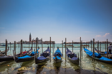 Grand Canal gondolas at pier, island of San Giorgio Maggiore in the background