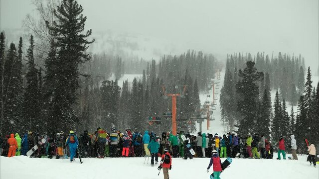 Time lapse of queue for the lift at the ski resort.