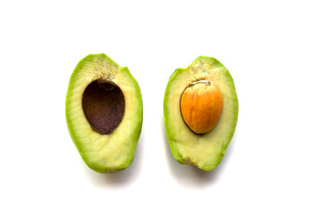 The two halves avocado on white background, one half with costachi, nuts. Isolated object, blank...