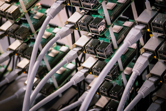 Cluster of Raspberry Pi 4 board. The Raspberry Pi is a credit-card-sized single-board computer. Conencted together as a cluster they can produce as much computation as a single laptop.