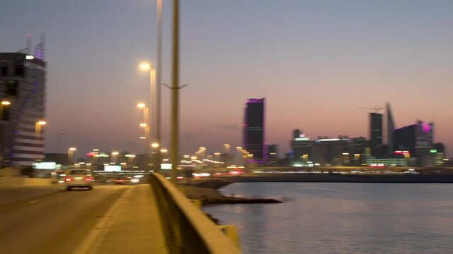 Nightshot - pan ltr from Shaikh Hamad causeway to the Diplomatic Area of Manama, Bahrain