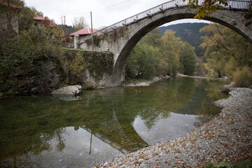The pedestrian stone bridge of Vovousa. One of the 44 villages Zagoria. Built in 1748 above the waters river Aoos. Next to Pindus National Park (Valia Calda).