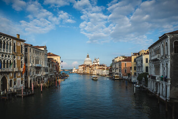Fototapeta na wymiar Beautiful view of famous Canal Grande and Basilica di Santa Maria della Salute in daylight, Venice, Italy