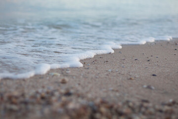 waves on the sandy beach. sea of azov in the south of Ukraine