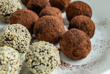 a lot of delicious chocolate truffles, rolled in cocoa and sesame, delicious and beautiful dessert