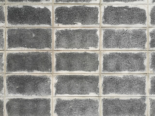grey brick block wall show Pattern stack block rough surface texture material background Weld the joints with cement grout