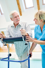 Senior man with walker is exercising walking