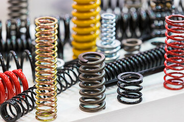 Metal springs of different sizes shot close-up.