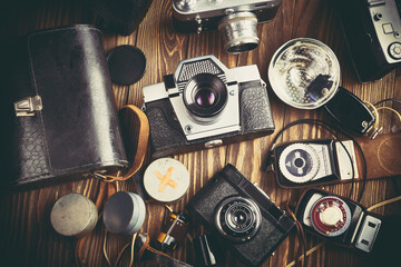 Old vintage photo cameras, flash and exposure meters