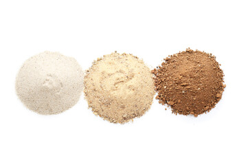 Heaps of different soils on white background