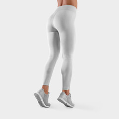 Template of white stretch leggings on a fit girl standing on toes in sneakers, women's sports pants for design presentation, side view.