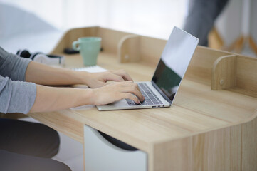 New normal Man using laptop computer working at home,Businessman typing computer keyboard