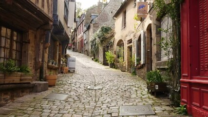 DINAN, FRANCE - APRIL 06, 2018: view of empty beautiful street with old traditional houses at the center of Dinan, Brittany, France
