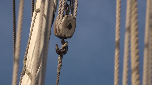 Hook and hand rope hoist on the deck of an old traditional ship