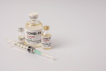 Coronavirus vaccine glass bottles on white background. Covid-19 medicine vaccination equipment. Research of coronavirus vaccine world pandemic concept.