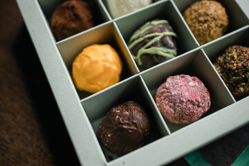 colored truffle candies in a gift box