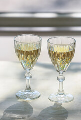 Glasses of tasty champagne on table