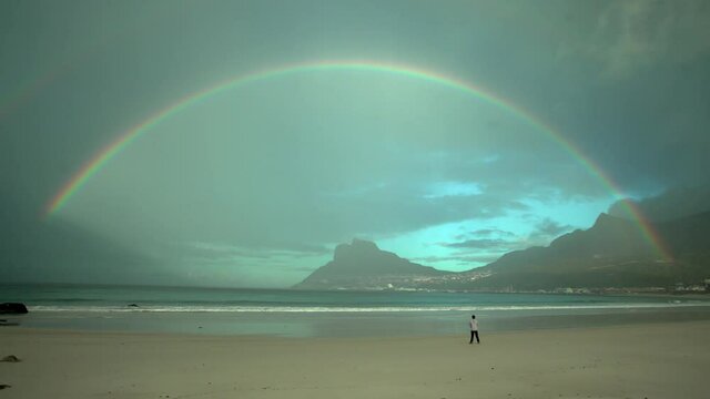 Rainbow stretching across bay after storm,Hout Bay,South Africa