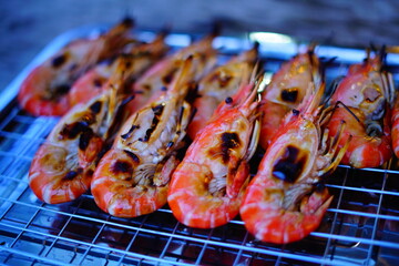 Grilled shrimp (Giant freshwater River prawn) grilling with charcoal at home, Natural Light in the evening. Bangkok, Thailand