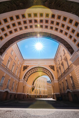 Fototapeta premium Yellow arch leading to the Palace square to the Hermitage Museum in Saint Petersburg, a tourist attraction in the summer
